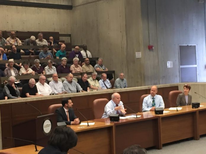 LGBT Aging Project Assistant Director Bob Linscott (speaking), Fenway Health Associate Vice President of Special Projects Robb Johnson , and LGBT Aging Project Director Lisa Krinsky testified at the hearing.