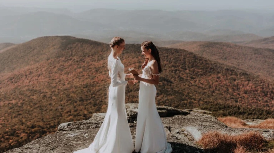 Couple hikes up Vermont mountain in wedding dresses to wed at summit